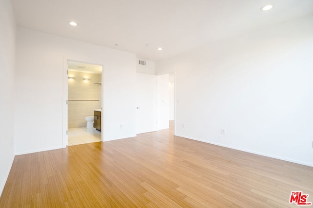 unfurnished room featuring light hardwood / wood-style floors