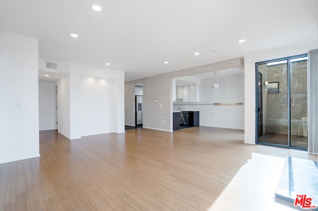 unfurnished living room featuring light hardwood / wood-style flooring