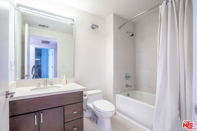 full bathroom with toilet, shower / bath combo, vanity, and tile patterned floors