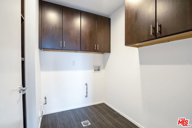 washroom with washer hookup, cabinets, and hookup for a gas dryer