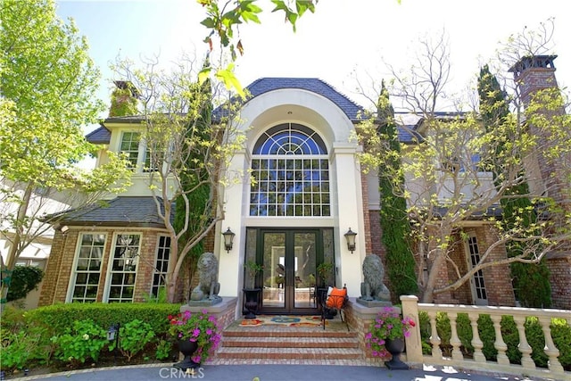 property entrance featuring french doors