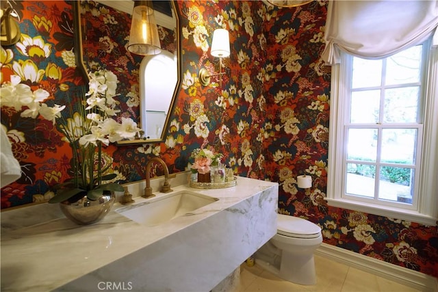 bathroom featuring tile patterned flooring, vanity, and toilet