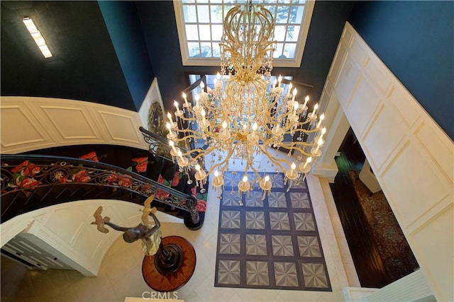 entryway featuring a chandelier and tile patterned flooring