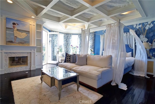 living room featuring ornamental molding, coffered ceiling, and hardwood / wood-style flooring