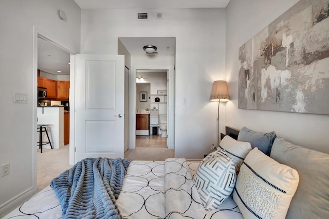 bedroom featuring light colored carpet