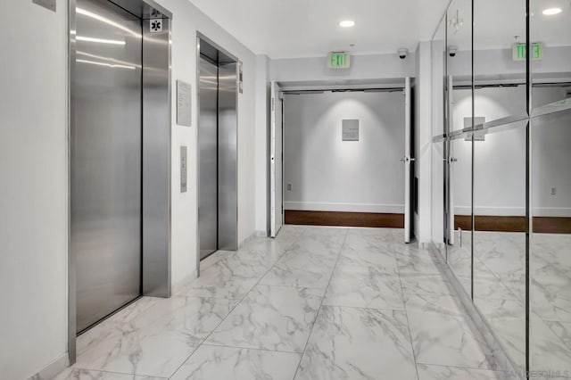 hallway featuring elevator