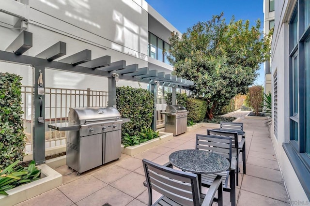 view of patio featuring a pergola and a grill