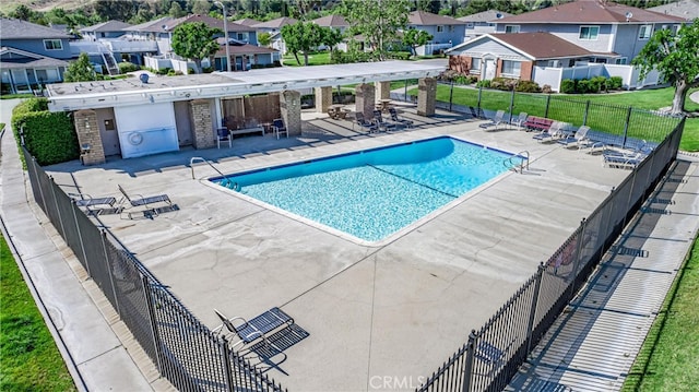 view of swimming pool with a patio