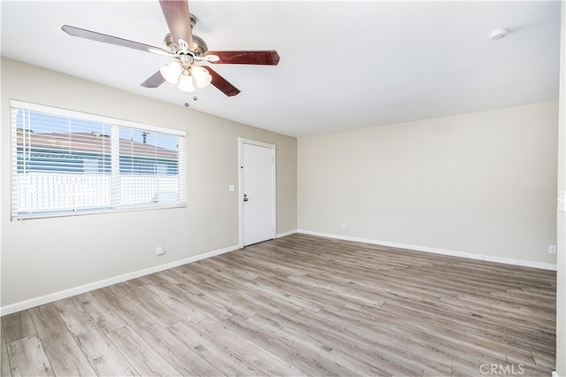 unfurnished room featuring ceiling fan and light wood-type flooring