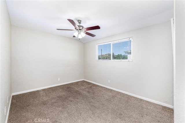 spare room with carpet floors and ceiling fan