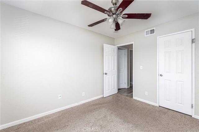 unfurnished bedroom featuring carpet floors and ceiling fan