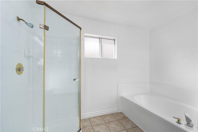 bathroom featuring independent shower and bath and tile patterned floors