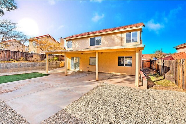 back of house featuring a patio area