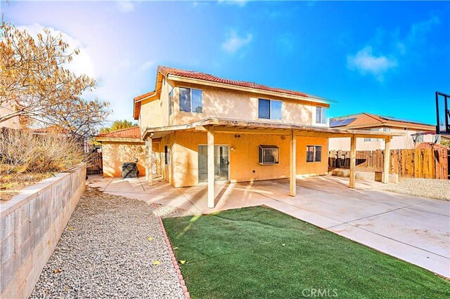 back of property with a patio area