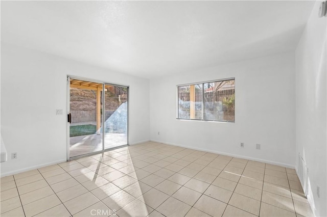 spare room with light tile patterned flooring