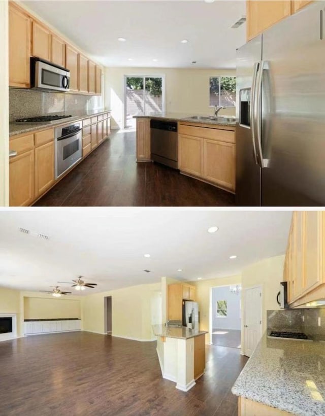 kitchen featuring a center island, stainless steel appliances, tasteful backsplash, light brown cabinetry, and sink