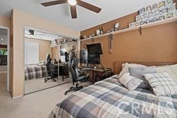 bedroom with ceiling fan and carpet flooring