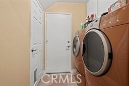 laundry room featuring washing machine and clothes dryer