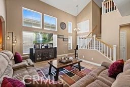 living room with a towering ceiling