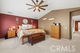 bedroom featuring light carpet, ceiling fan, and vaulted ceiling