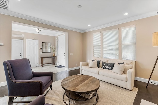 living room with crown molding and light hardwood / wood-style flooring