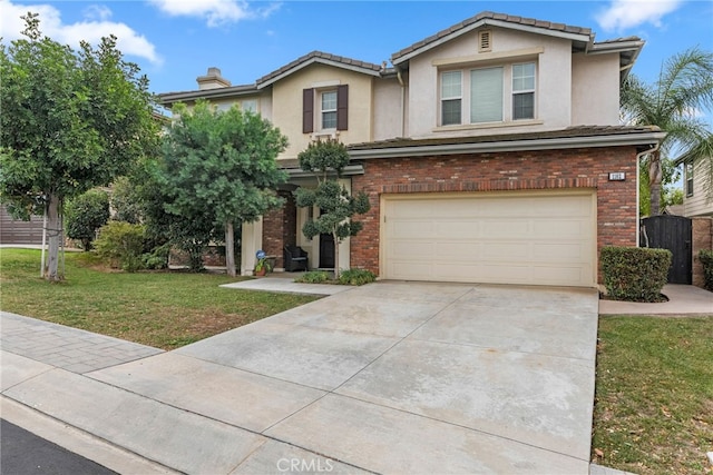 view of front of home with a front lawn and a garage