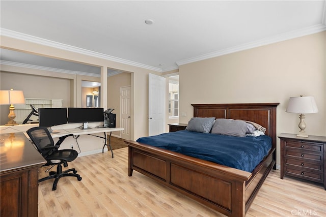 bedroom with ornamental molding and light hardwood / wood-style flooring