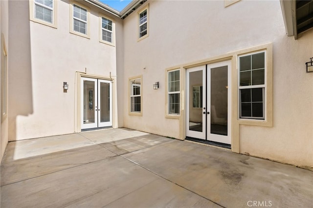 back of house featuring french doors and a patio