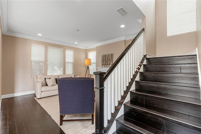 stairway featuring hardwood / wood-style floors and crown molding