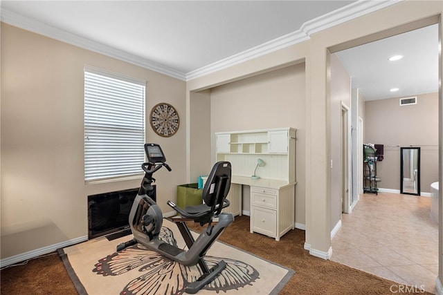 workout room with light tile patterned floors and crown molding