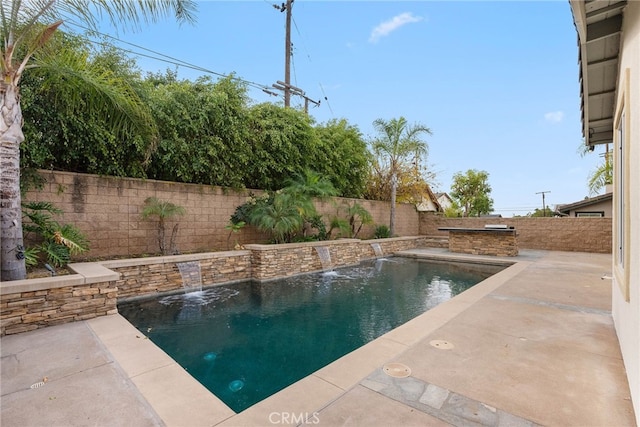 view of pool with pool water feature and a patio