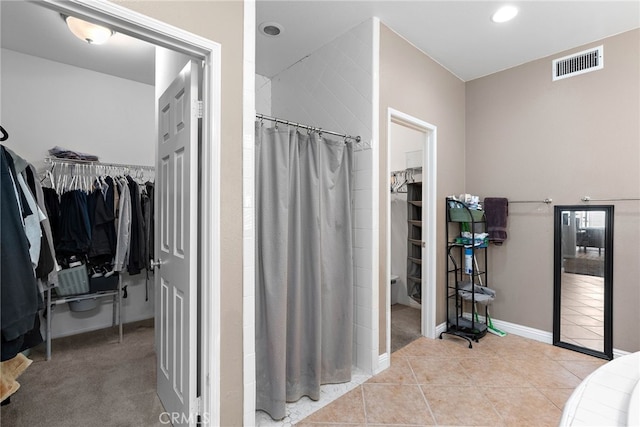 bathroom with tile patterned floors