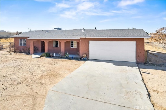 ranch-style home featuring a garage