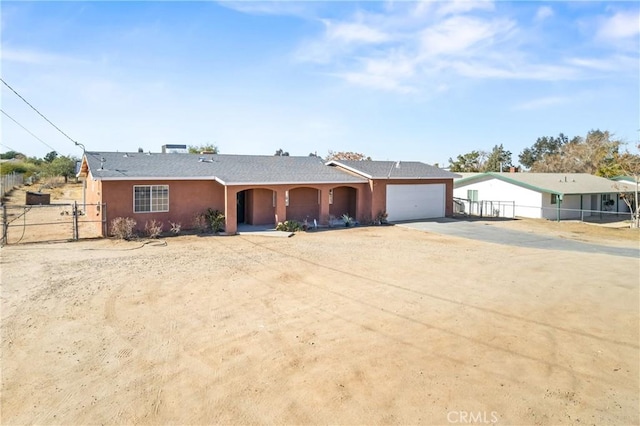 ranch-style home with a garage