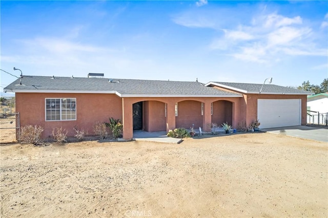 single story home featuring a garage