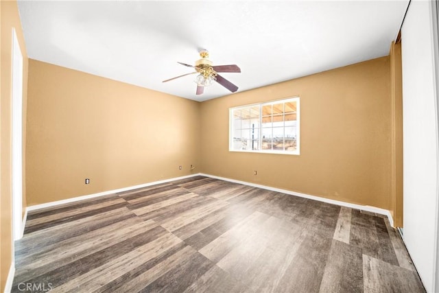 unfurnished room featuring ceiling fan and hardwood / wood-style floors