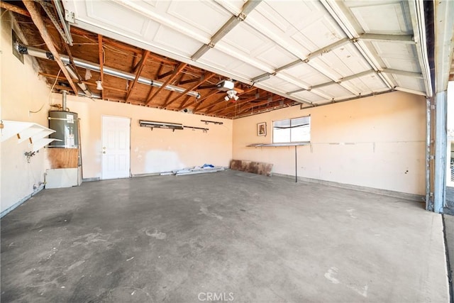 garage featuring water heater and a garage door opener