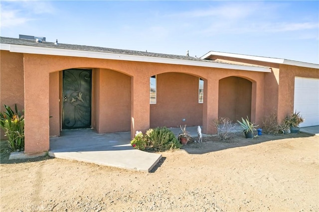 property entrance featuring a garage