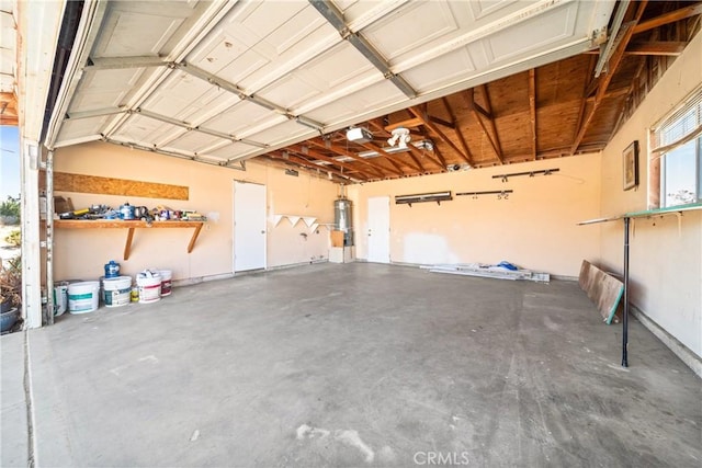 garage featuring secured water heater