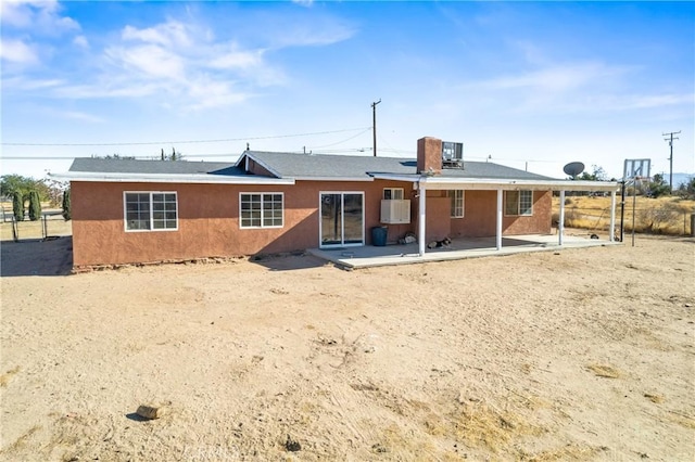 back of house with a patio area