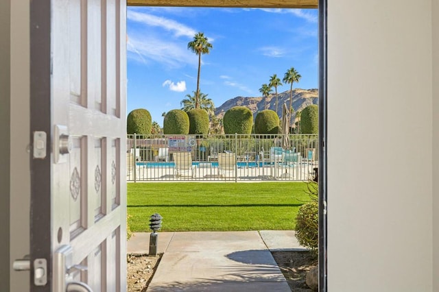 doorway with plenty of natural light and a mountain view