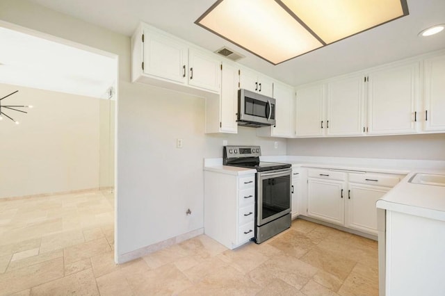 kitchen featuring sink, white cabinets, and stainless steel appliances