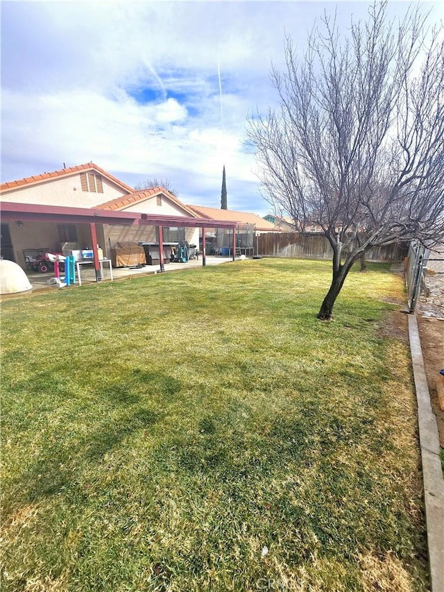 view of yard featuring fence