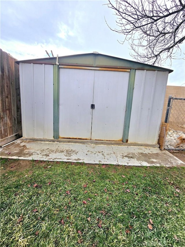 view of shed with fence