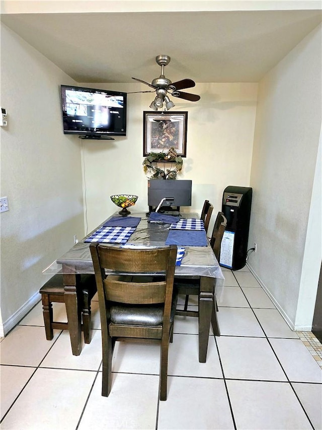 dining room with ceiling fan and light tile patterned flooring