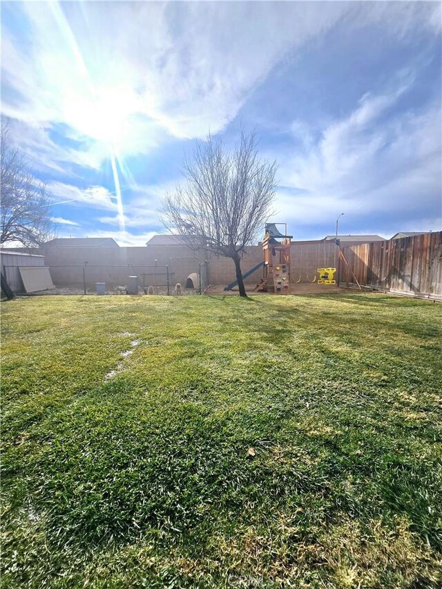 view of yard with a playground