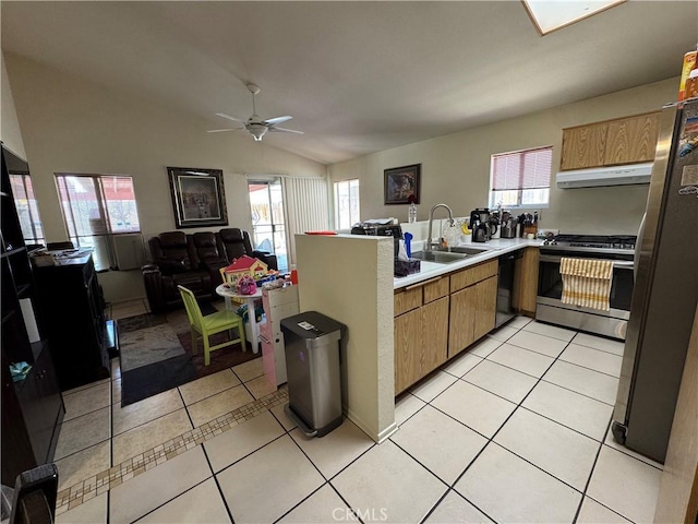 kitchen featuring light tile patterned floors, appliances with stainless steel finishes, extractor fan, and a sink