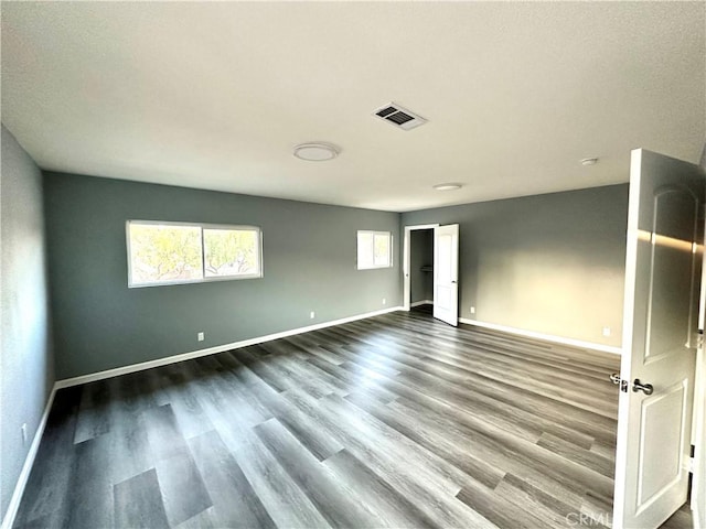 empty room featuring wood-type flooring