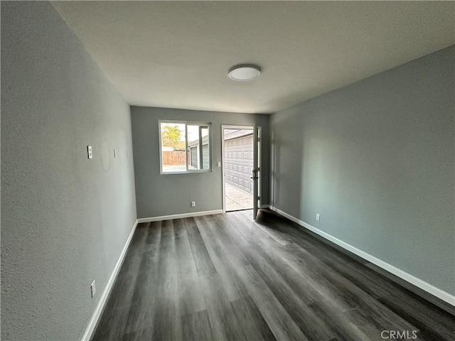 empty room featuring dark hardwood / wood-style floors