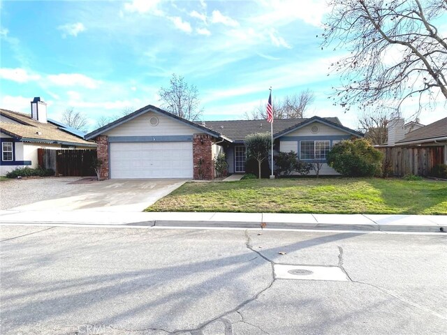 single story home featuring a front yard and a garage